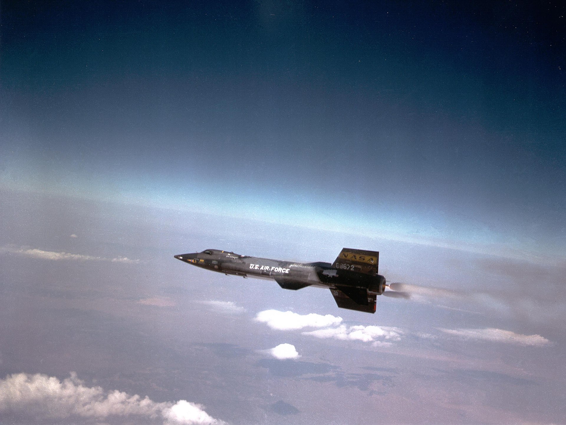 North American X-15 rocket plane in flight, showcasing its sleek design and rocket propulsion at high altitude, embodying the pinnacle of hypersonic research.